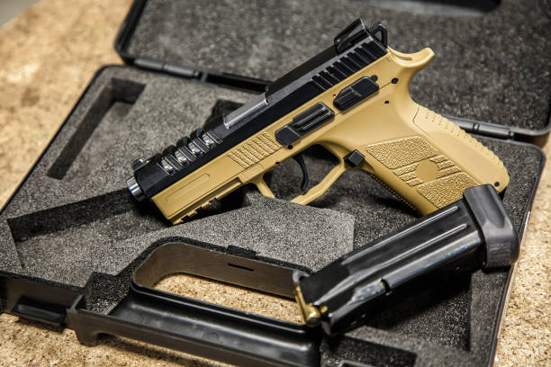 istock modern pistol on the table in the workshop 1138272474