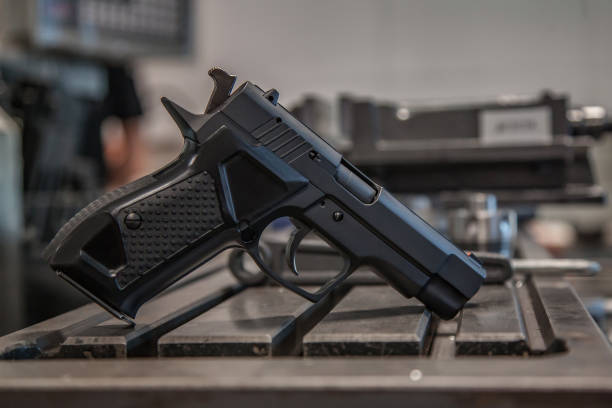 istock modern pistol on the table in the workshop 1138272552
