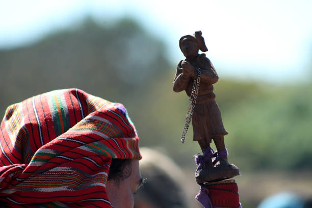 Members of the indigenous community of El Salvador perform an indigenous summer solstice ceremony at the Mayan ceremonial center of San Andrés, in the department of La Libertad