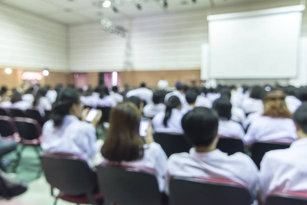 istock Blurred abstract background full seat rows in business or educational conference presentation in auditorium hall 1138281376