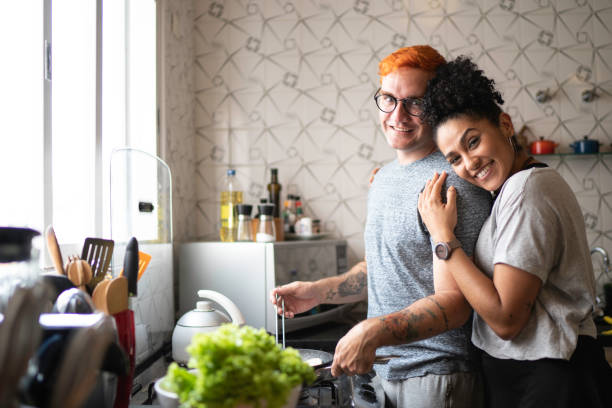 istock Couple cooking together at home 1138286455