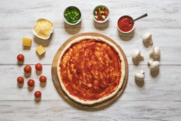 istock Cooking pizza. Rolling out the raw dough. 1138286660