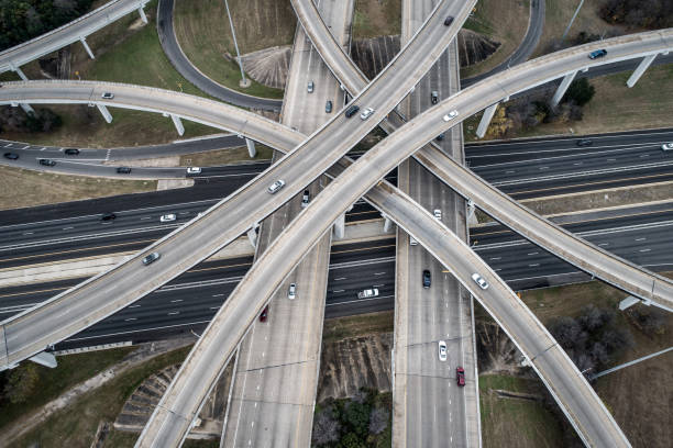 istock Aerial drone looking down view above Crossing roads and intersections of mass development 1138287755