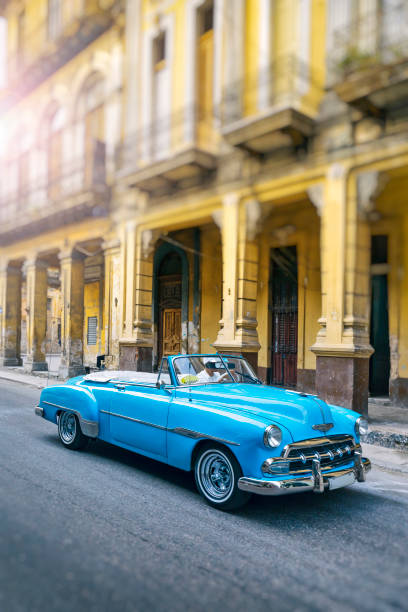 Vintage blue oldtimer car driving through Old Havana Cuba