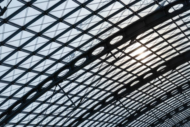 Railway station in the City Steel scaffolding on the ceiling with sun. büro stock pictures, royalty-free photos & images