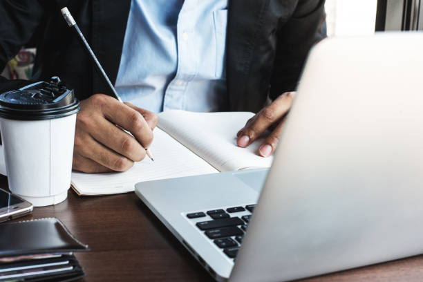 istock A business man using laptop at the coffee shop. 1138295304