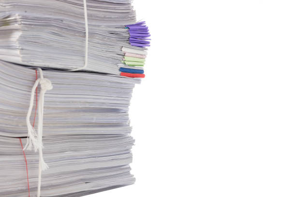 istock Stack of business papers isolated on white background 1138297767