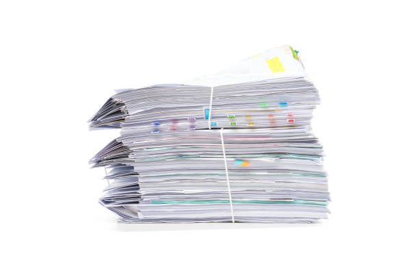 istock Stack of business papers isolated on white background 1138297782