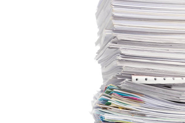 istock Stack of business papers isolated on white background 1138297832