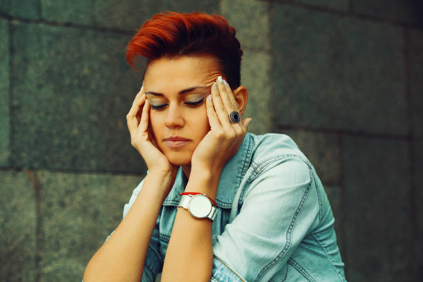 portrait of a depressed woman - red hair hairstyle dyed hair women imagens e fotografias de stock