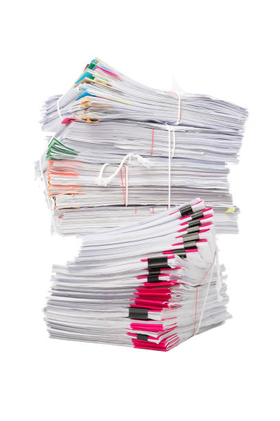 istock Stack of business papers isolated on white background 1138297867
