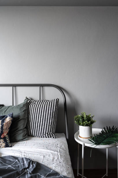 istock Bedroom Corner with artificial plants in white ceramic marble pattern paint on white metal side table in modern scandinavian style / modern minimal / cozy interior design concept 1138300213