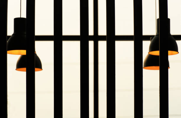 istock black lamp with orange light with line of  architecture interior background 1138302660