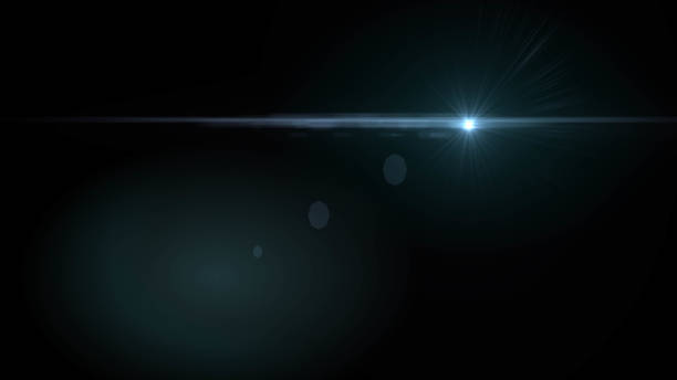 istock Lens flare  glow light effect  on black background. Easy to add overlay or screen filter over photos 1138302936