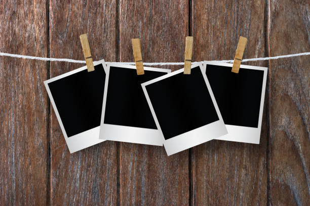 istock Clothespin hanging with blank photo papers. 1138303744