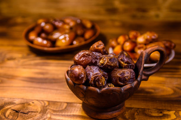 istock Date fruits on the rustic wooden table 1138310286