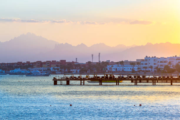 istock Sunset scenery with sea, mountains and mooring 1138315365