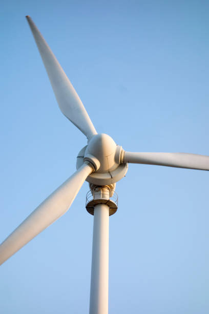 istock Rocky seashore and Wind turbines 1138316511