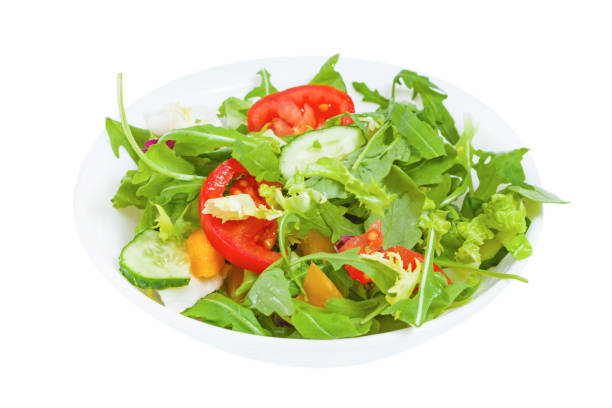 istock Fresh vegetable salad  in plate, isolated 1138318264