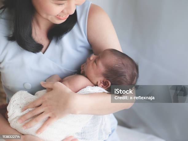 Close Up Portrait Of Beautiful Young Mother Asian Carrying Little Baby Girl In Home And Sunlight In The Morning Healthcare Love Relationship Concept Stock Photo - Download Image Now