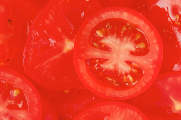 istock Fresh sliced tomato background - healthy food 1138322860
