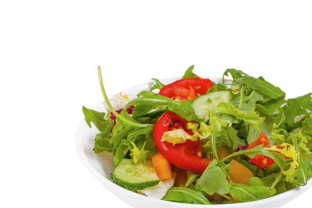 istock Fresh vegetable salad  in plate, isolated 1138324139