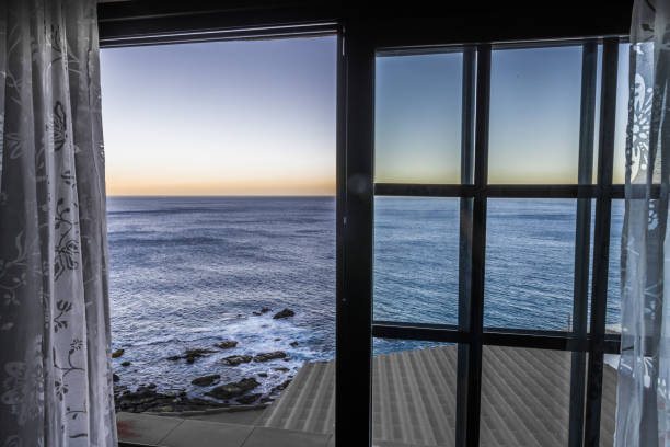 Morning view of the Atlantic coast from the window of a small rural house on the coast of Tenerife.