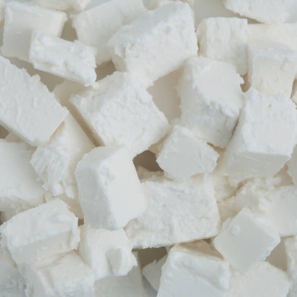 istock Fresh tasty Feta Cheese background 1138325774