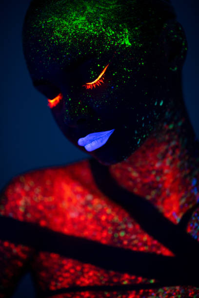 istock One woman painted with fluorescent make up 1138326744
