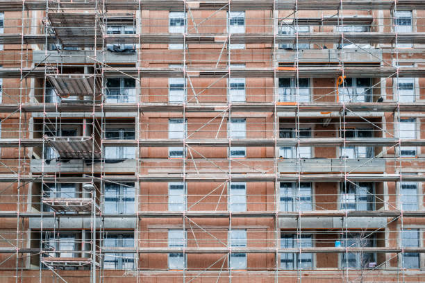 istock building construction site , scaffolding on  house facade 1138328324