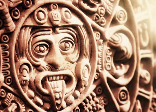 Ancient Aztec Stone of the Sun A modern ceramic reproduction of the ancient calendar known as the Stone of the Sun, carved by Aztecs in the 1500s. This is a faithful reproduction of a traditional artwork dating back 600 years, hence long out of copyright. tonatiuh stock pictures, royalty-free photos & images