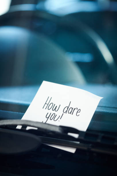 istock Angry note under windshield wiper reads 
