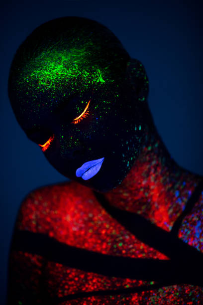 istock One woman painted with fluorescent make up 1138330167