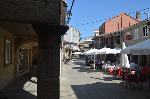 Arcades Of The Real Street Dated In The X Century In The Medieval Town Of Walls. Nature, Architecture, History, Street Photography. August 19, 2014. Muros, Pontevedra, Galicia, Spain.