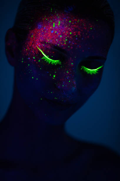 istock One woman painted with fluorescent make up 1138331375