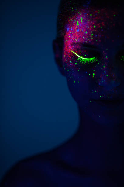 istock One woman painted with fluorescent make up 1138331409