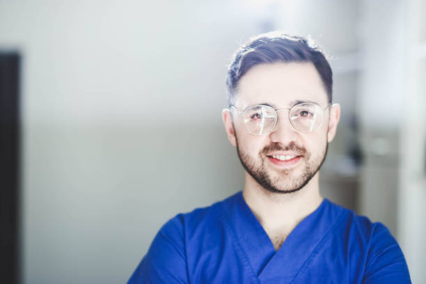 istock brunet doctor in glasses and blue uniform 1138332552