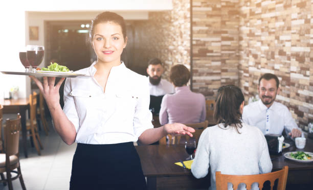 istock Female waiter showing country restaurant 1138333089