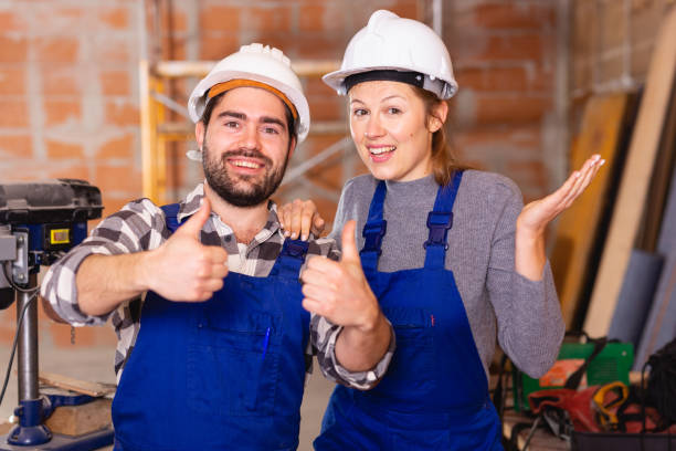 istock Portrait of two successful workers in uniform inside brick cottage 1138333352