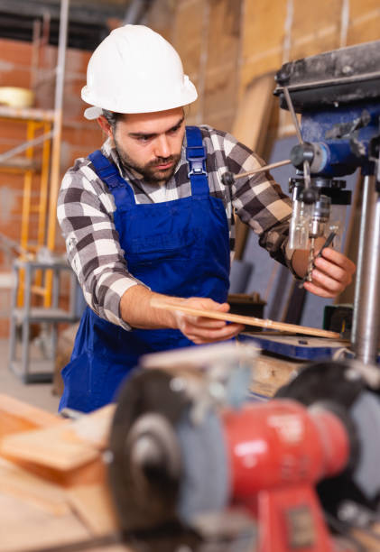 istock Portrait of worker who works on drilling machine 1138333396