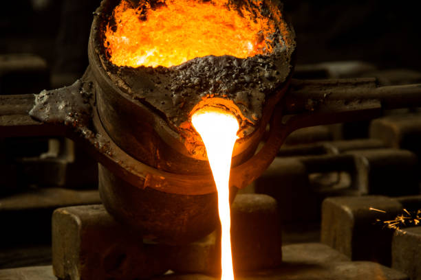 istock metal casting process with red high temperature fire in metal part factory 1138333939