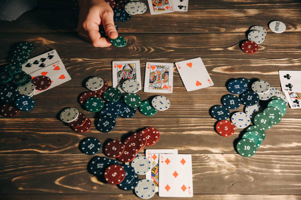 istock Man is playing poker. Gamble gaming. Free time hobby. Hands over the table. 1138334063