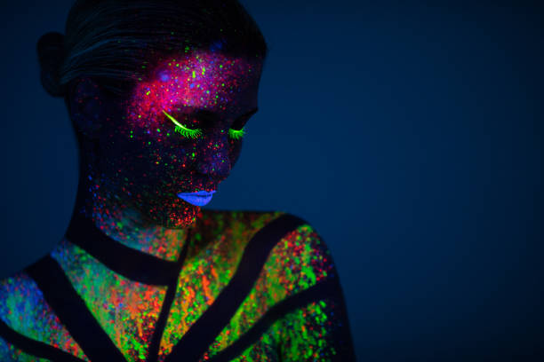 istock One woman painted with fluorescent make up 1138334437