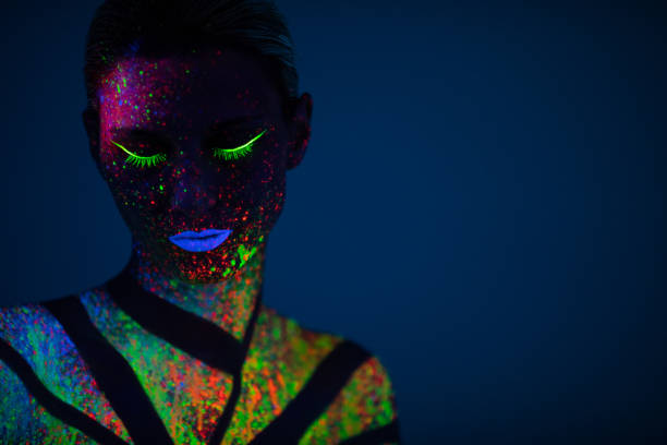istock One woman painted with fluorescent make up 1138334438