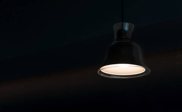 istock modern lamp hanging from the ceiling with copy space. Dark Tone 1138334574
