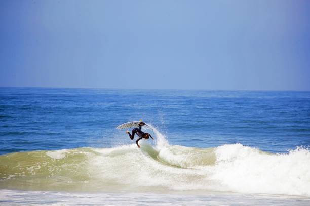 istock Man Surfing In Sea Against Clear Sky 1138335411