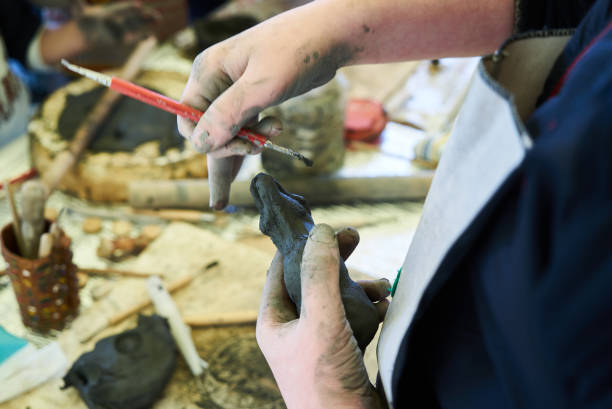 istock Hands make clay toy. Close-up of hands , potter working 1138335477