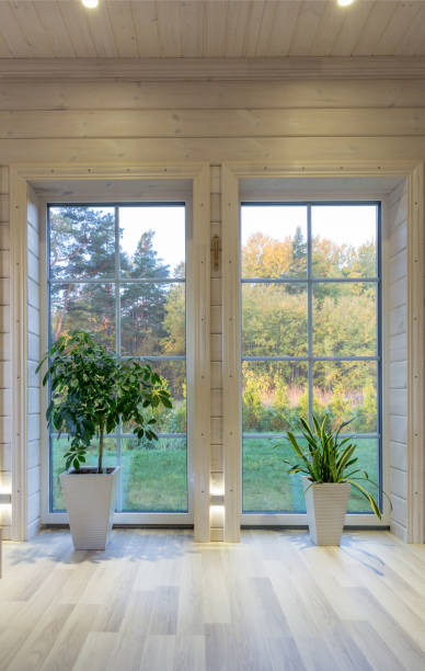 istock Bright photo studio interior with big window, high ceiling, white wooden floor 1138341049