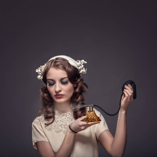 istock Retro woman applying perfume 1138343179