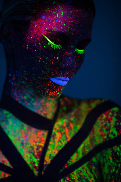 istock One woman painted with fluorescent make up 1138347860